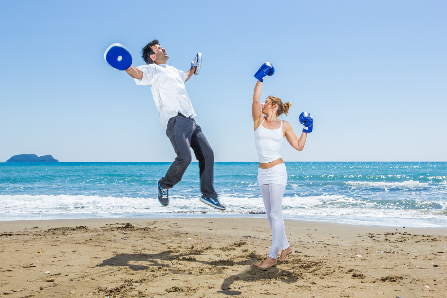 Couple Training Boxing on the Beach